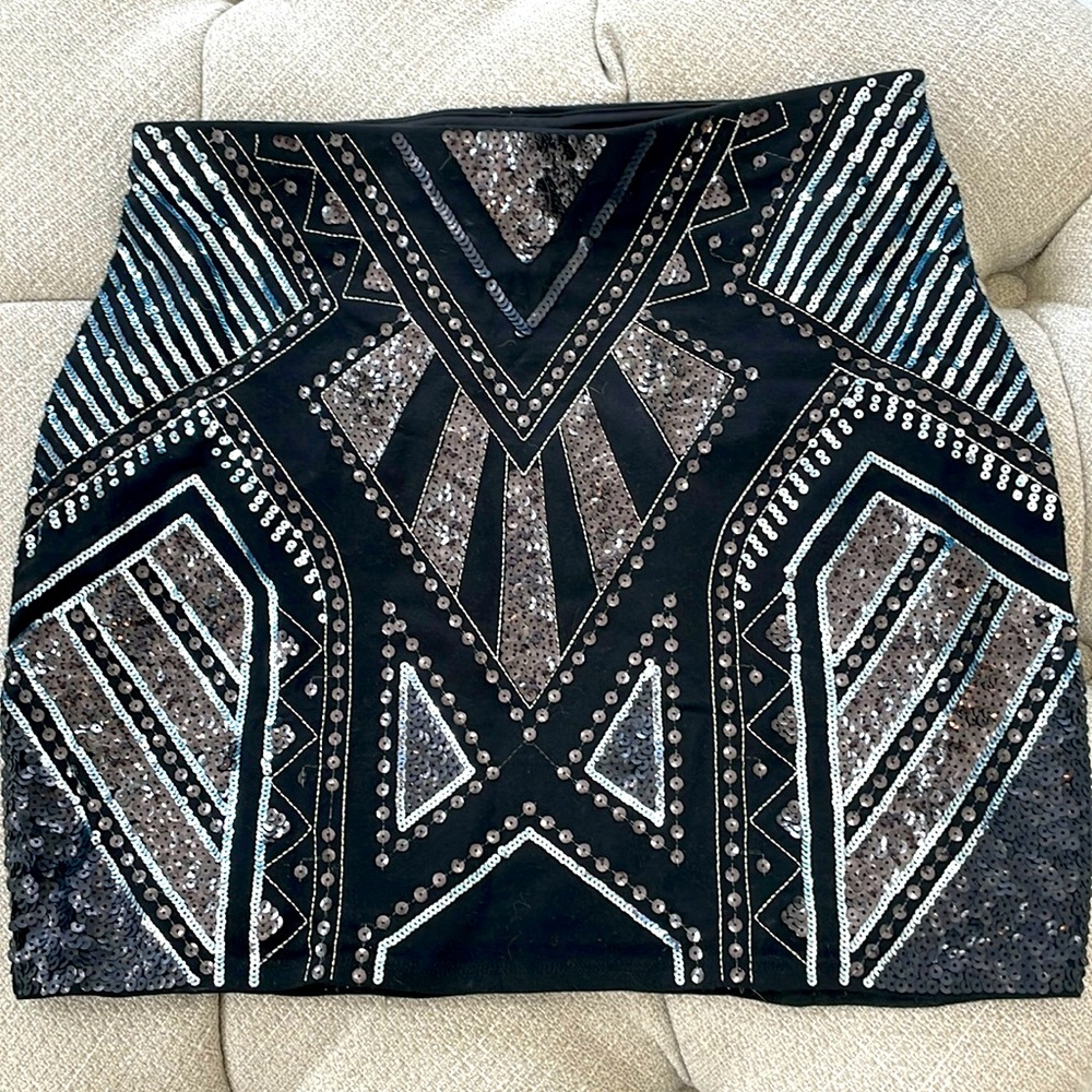 Express medium sequined black skirt.  Stretchy material. Comfy